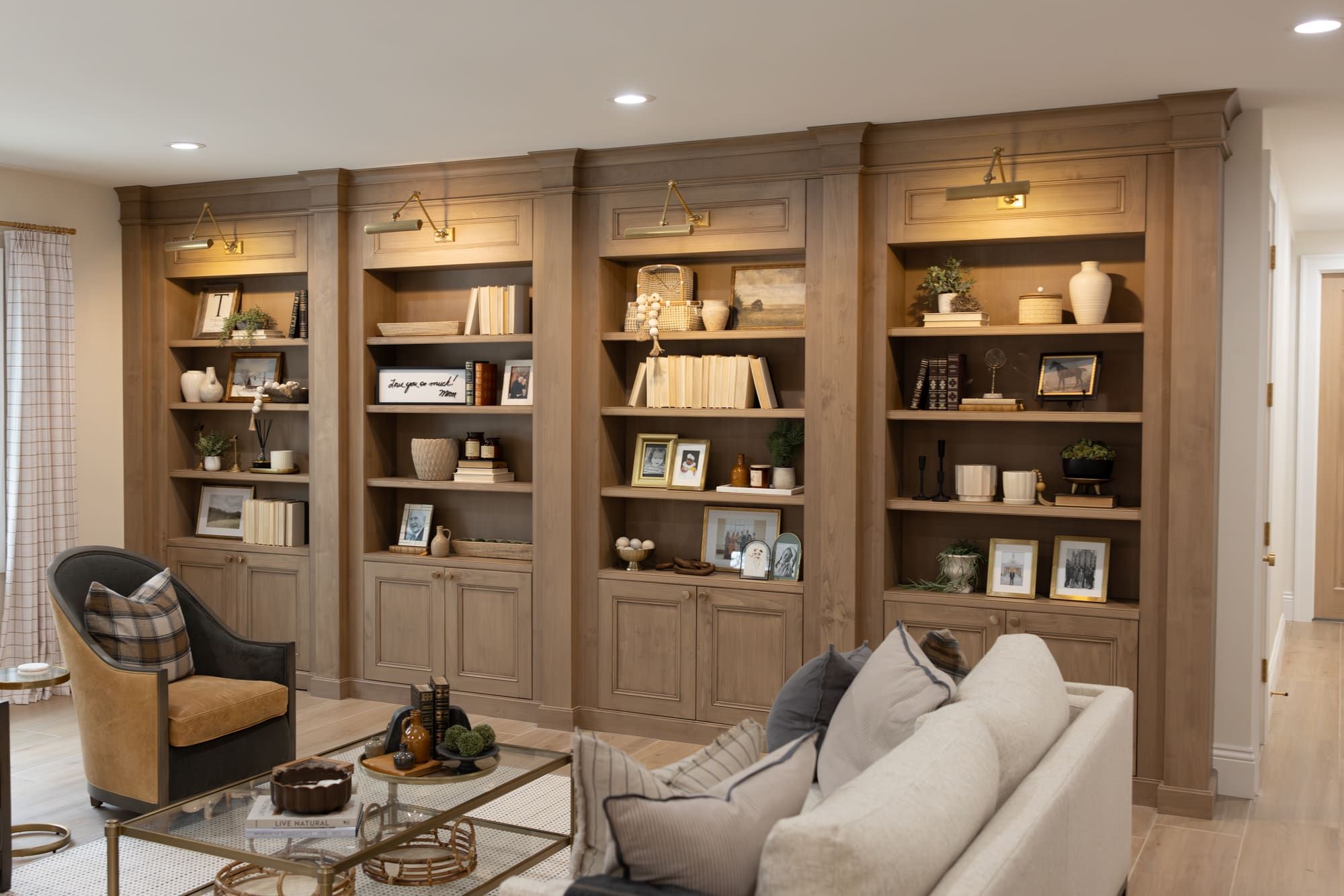 Floor-to-ceiling library built-ins with a hidden cabinet door