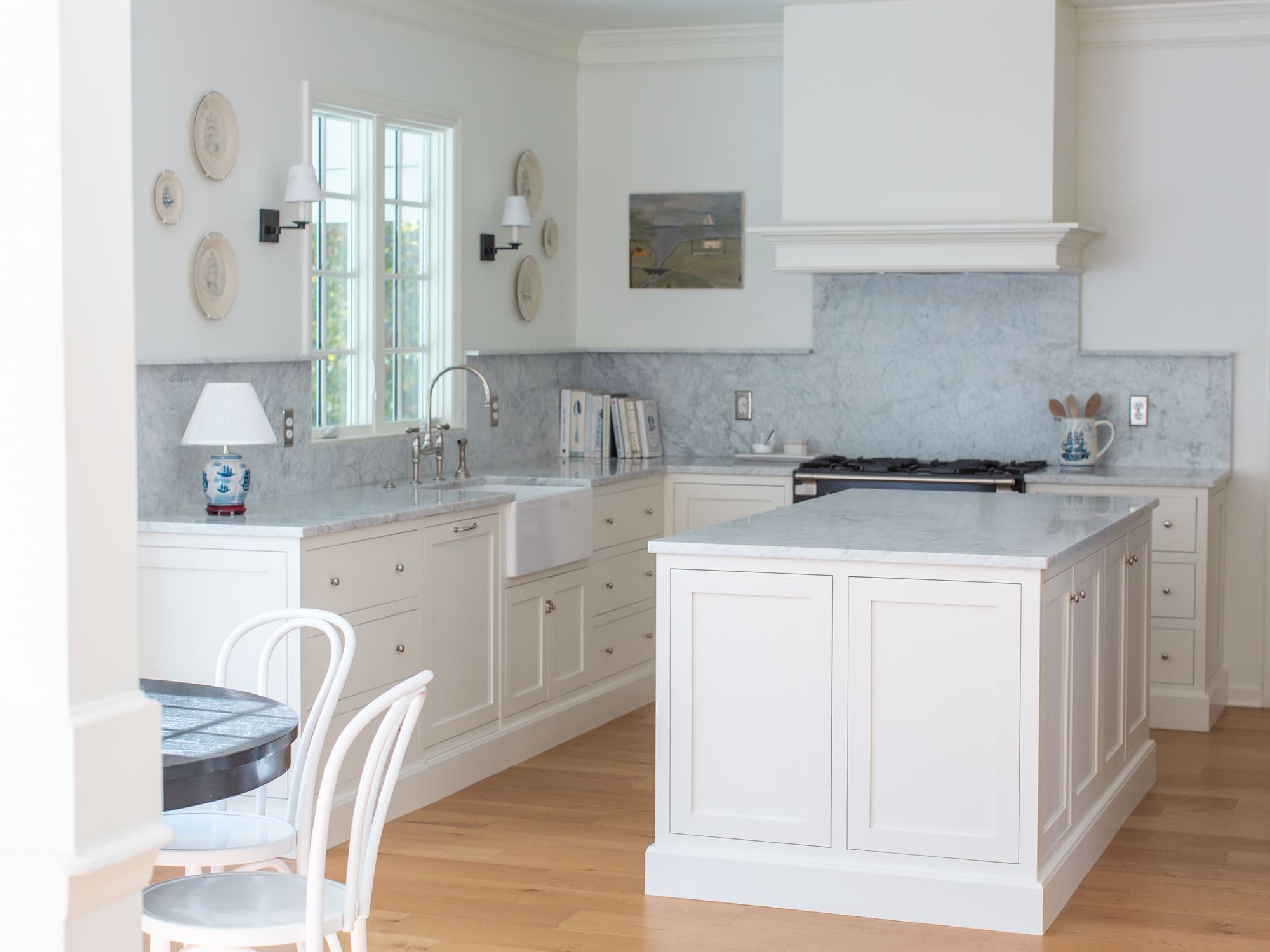 Traditional inset kitchen cabinets with a custom-built range hood